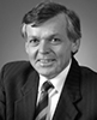 Black and white head shot of John Dawkins, former Minister for Finance. Black and white head shot of Peter Walsh, former Minister for Finance. He is smiling and wearing a dark jacket, shirt, and tie. 