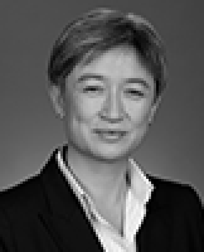 Black and white head shot of Penny Wong, former Minister for Finance and Deregulation. She is smiling and wearing a dark jacket and shirt. 